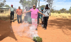 The women line up for a smoking ceremony on the second day of the retreat. A smoking ceremony is welcoming, cleansing and protects you out on Country.